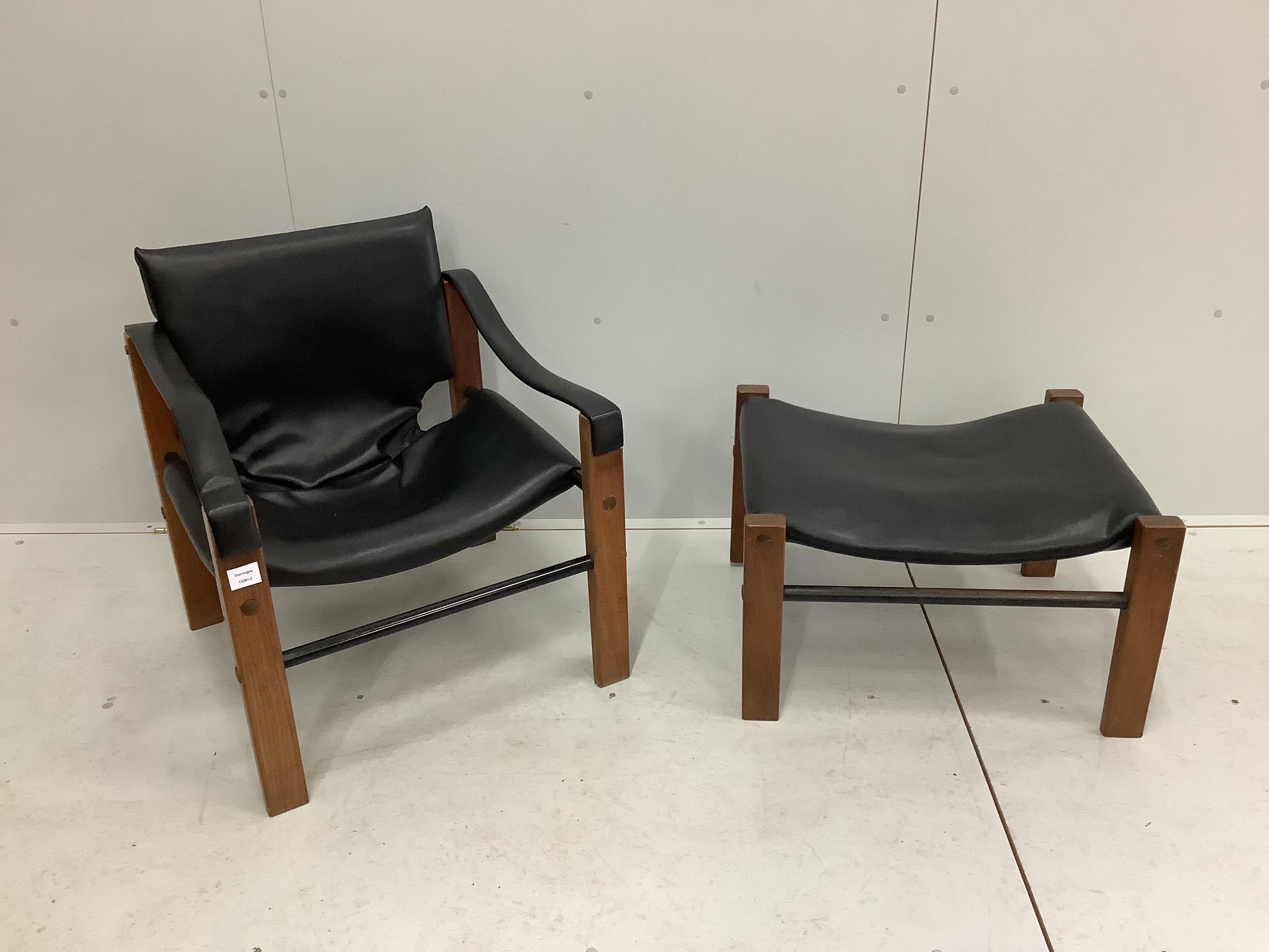 Maurice Burke for Arkana, a black leather and teak safari armchair, width 62cm, depth 60cm, height 72cm and foot stool